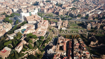 Aerial drone view from Roman Forum one of the main tourist attractions which was build in ancient times as the site of triumphal processions and elections next to Colosseum, Rome, Italy