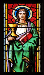 Saint John the Evangelist, stained glass window in parish church of Saint Mark in Zagreb, Croatia 