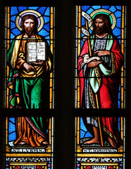 Saints Luke the Evangelist and John the Baptist, stained glass window in parish church of Saint...
