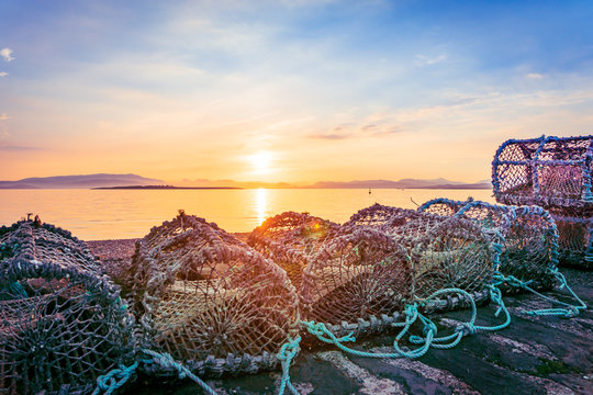 Fishing Baskets on the pier in Broadford early in the morning