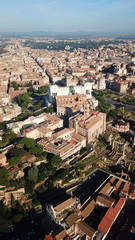 Naklejka premium Aerial drone view of iconic neoclassic building of Altar of the Fatherland - Altare della Patria, known as the national Monument to Victor Emmanuel II in city of Rome, Piazza Venezia, Italy