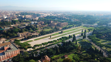 Obraz premium Aerial drone photo of iconic Circus Maximus site of an ancient Roman chariot racing stadium and mass entertainment venue next to famous Colosseum, Rome, Italy