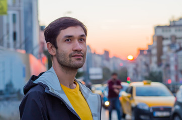 Vibrant eyes. An exalted man enjoying traveling around Europe. Sunset in Istanbul.
