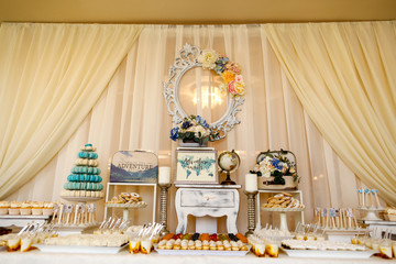 Delicious candy bar with cucakes, cookies and other sweets