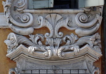 Beautiful house facade with carved stone in Mantua, Italy