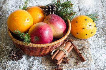 Christmas natural eco ornament with organic fruits on the snowy old table
