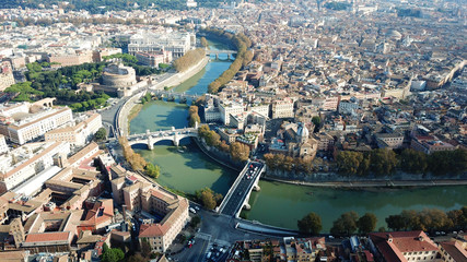 Obraz premium Aerial drone view of iconic Castel Sant' Angelo (castle of Holy Angel) and Ponte or bridge Sant'Angelo with statues in river of Tiber next to famous Vatican, Rome, Italy