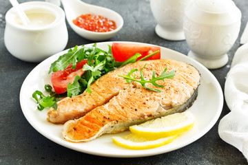 grilled salmon steak with cream sauce.