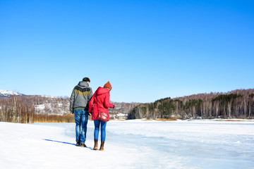 Couple walking on a frozen lake