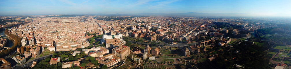 Fototapeta na wymiar Aerial drone panoramic view from Roman Forum one of the main tourist attractions which was build in ancient times as the site of triumphal processions and elections next to Colosseum, Rome, Italy