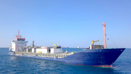 General cargo ship at sea - Aerial image