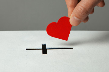 Donation of your heart as symbol of love for the religion of Christianity. Box for donations with...