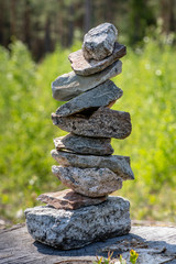 Heap of rocks stapled in a weight balance number