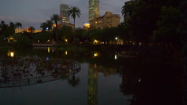 night illuminated taipei city center famous building park pond reflection panorama 4k taiwan

