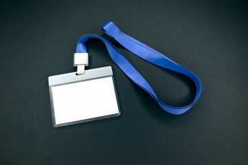 White empty staff identity mockup with blue lanyard. Name tag, ID card. Black background