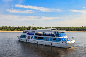 Fototapeta na wymiar Tourist ship sailing on the Dnieper river in Kiev