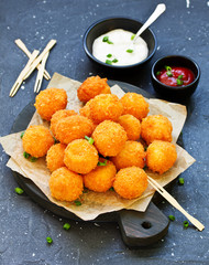 cheese balls with tomato sauce.