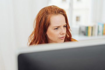 Young businesswoman working at a desktop