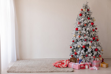 Christmas tree in a room with toys and gifts holiday new year winter postcard