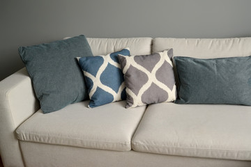  Sofa with throw pillows. Living room interior fragment
