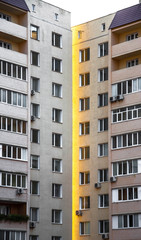 windows of a modern building with orange walls