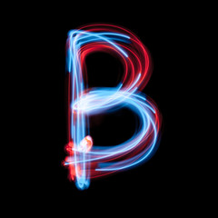 Letter B of the alphabet made from neon sign. The blue light image, long exposure with colored...
