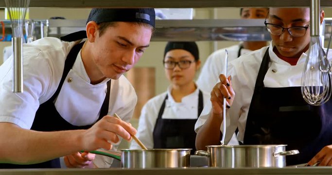 Chef preparing food in kitchen at restaurant 4k