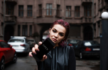 Obraz premium A girl fished out a hand forward. In a hand for a girl mobile telephone