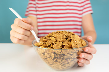 Breakfast with whole grain cereals concept. Illustrative minimalistic image of healthy vegetarian food on the table and hungry person