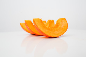 Sliced pumpkin on a white background