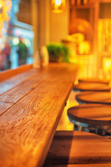 Picture of cafe interior with wooden table and chairs