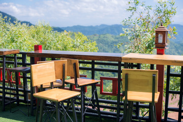 Terrace Chairs with Mountain and Sky Views