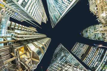 looking directly up at the finacial district skyline at night, london 