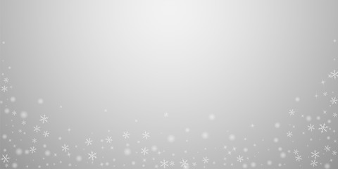 Obraz premium Sparse glowing snow Christmas background. Subtle f