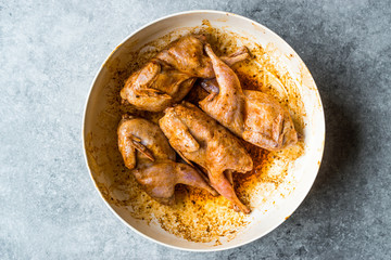 Raw Quail Meat with Sauce Ready to Cook in Bowl.