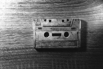 Retro cassette tape over wooden table. top view. copy space