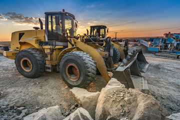 Two excavators removing stone in the construction works of a road in Spain