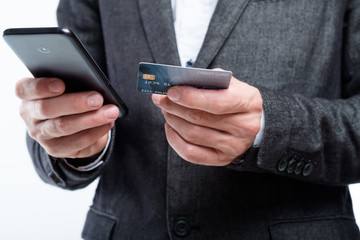 mobile wallet. nfc and digital payment apps. man holding credit card and smartphone.
