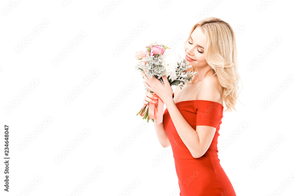 Wall mural attractive woman in red dress smelling flowers isolated on white