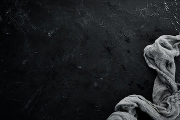 Black stone background. Top view. Free copy space.