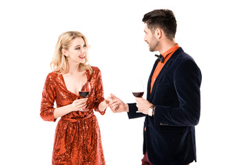 Beautiful young couple with glasses of wine isolated on white