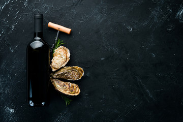 Fresh oysters with ice and red wine. Seafood. Top view. Free copy space.