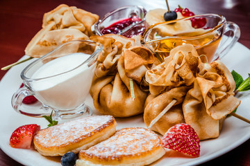 sweet pancakes with fruits and berries
