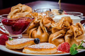 sweet pancakes with fruits and berries