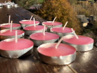 Candles on the windowsill in the mountains