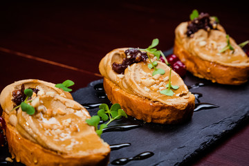 Chicken liver pate with cranberry sauce, served with croutons