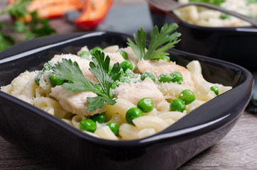 Traditional pasta with chicken slices
