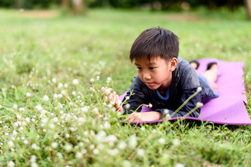 Young girl sit on a flower field
