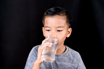 Young boy drink fresh water