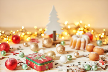Fototapeta premium Christmas cake and cookies on table. Christmas decorations with lights background. Happy New Year! Christmas greeting card. Winter card template. Xmas concept. Holiday Banner. Feast of Nativity. 